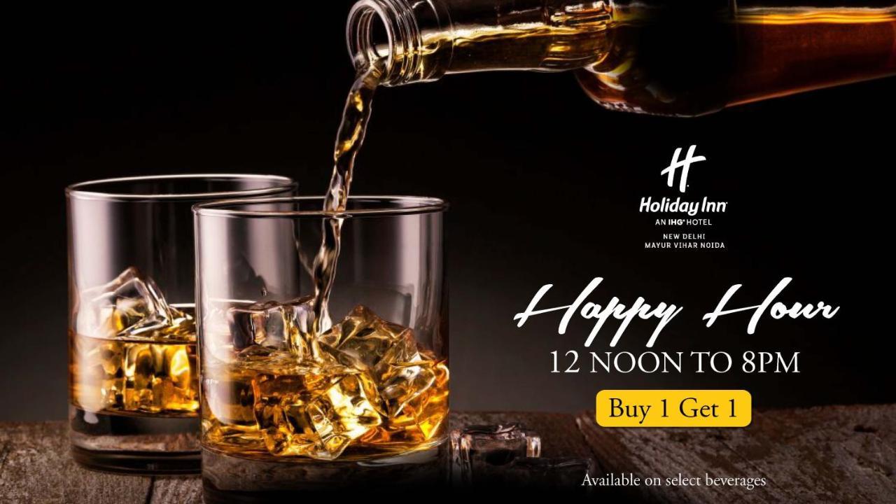 فندق هوليداي إن نيودلهي مايور فيهار نويدا المظهر الخارجي الصورة A poster advertising a happy hour